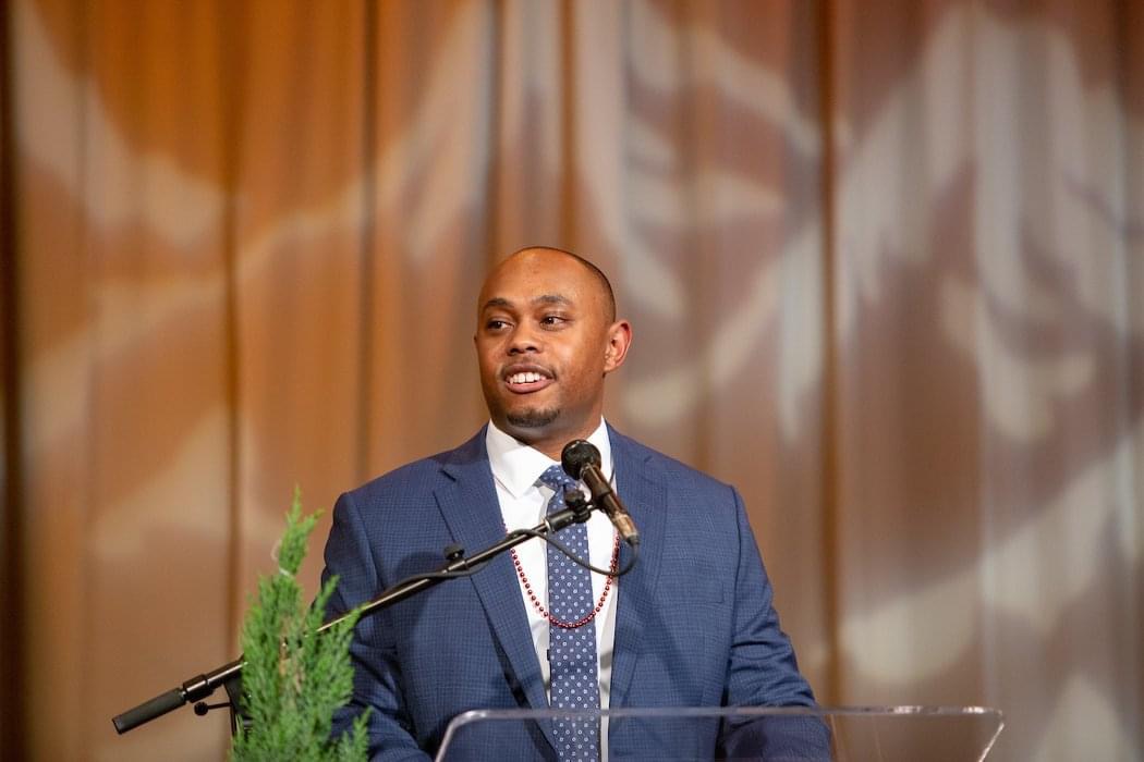 Erik Selden speaking on stage